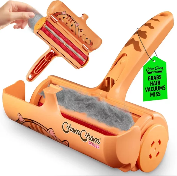 Limited edition cat design ChomChom roller with the lid open, revealing a chamber full of trapped gray fur and the brush mechanism.