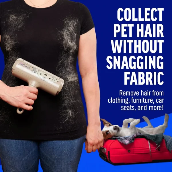 A person holding the roller against a black t-shirt covered in shed fur to show it cleans without snagging fabric. A small dog rests in a red suitcase in the corner