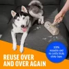 A husky dog lying on a dark grey sectional sofa while a hand cleans the upholstery with the reusable roller. Text highlights that no sticky tape is required